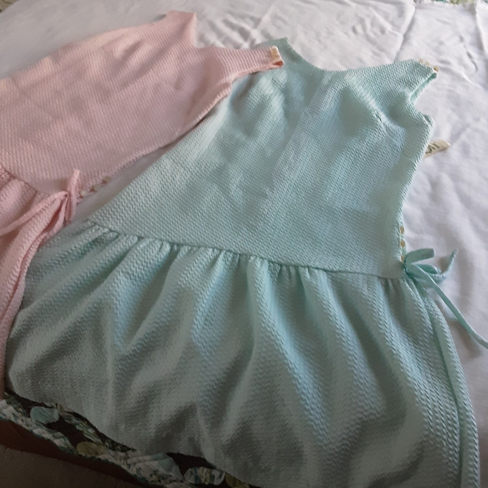 2 Dresses with a drop waist and zipper on the back.